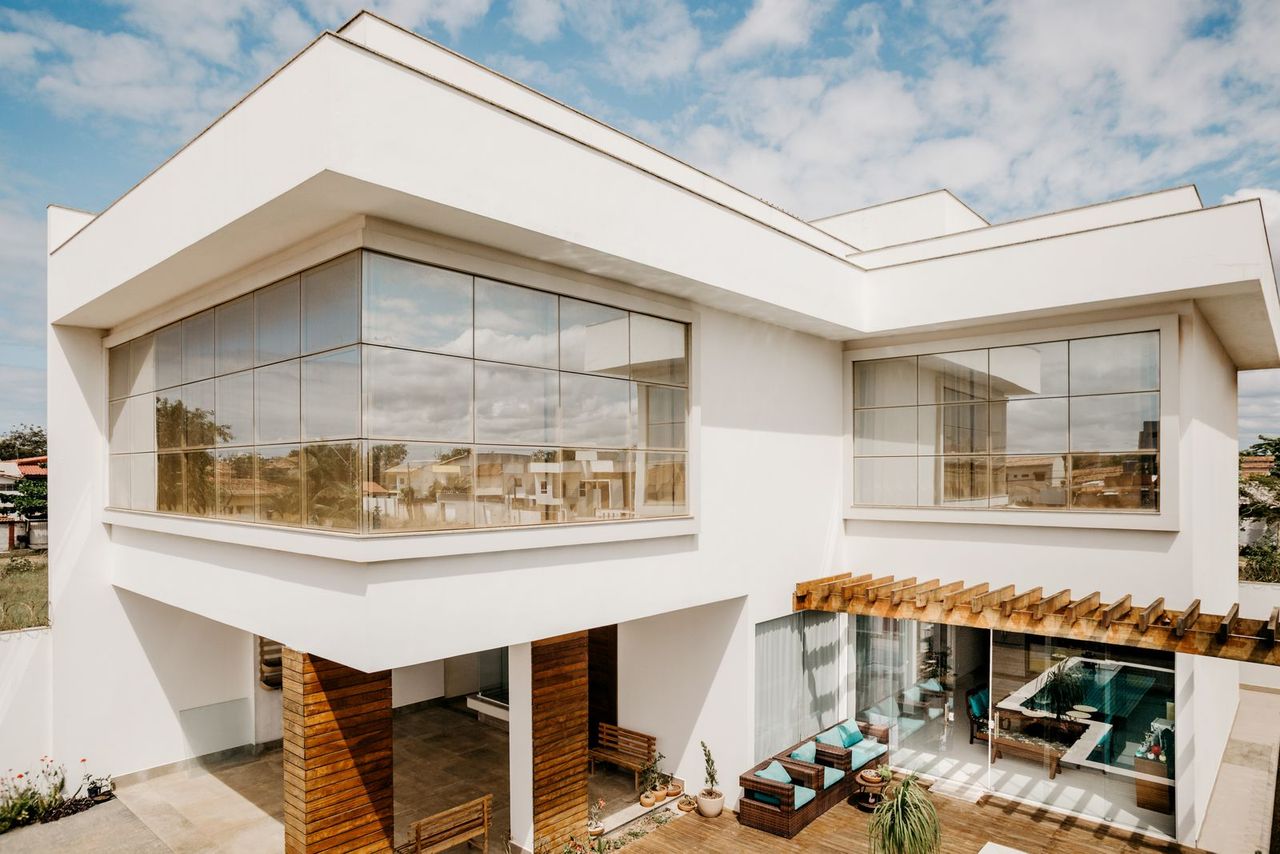 Modern two-storey family home with balcony and landscaped entrance, representative of S&Y Ibro Ventures listings